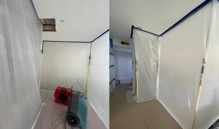 Technician creating a containment barrier in preparation for mold removal