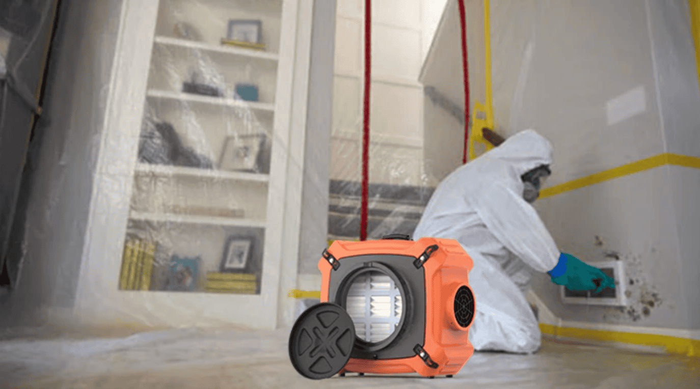 HEPA air scrubber machine operating in a contained room