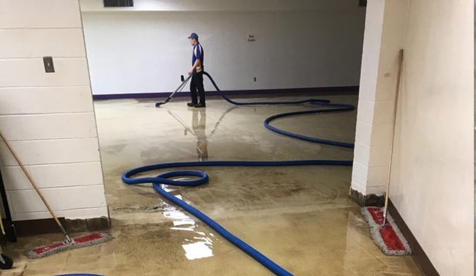 IICRC certified technician performing structural drying in a Texas home