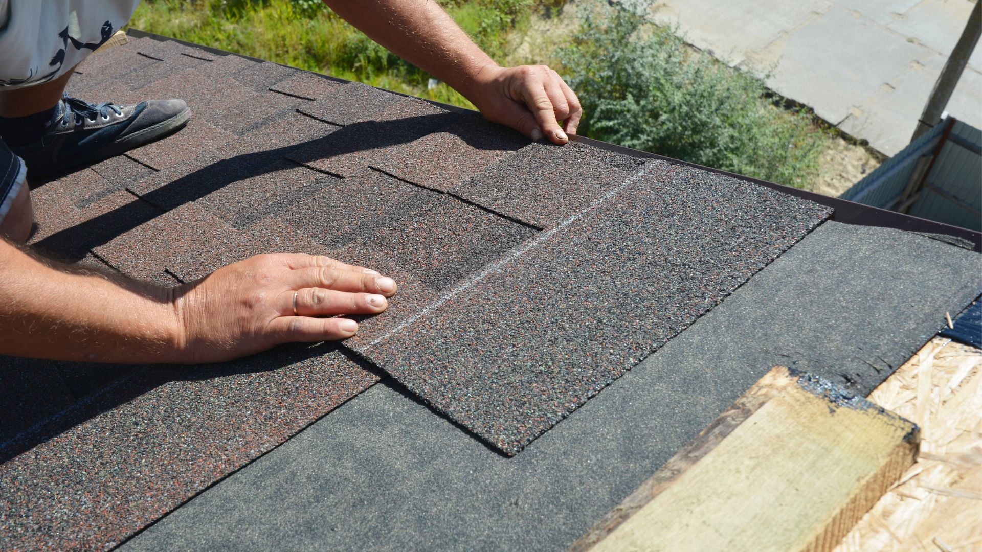 close up of high quality architectural shingles being installed by a professional roofer