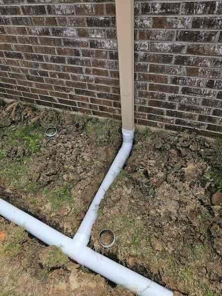 down-net_http20260731-150-2y1nt7 Yard drainage directing water away from a home's foundation in North Texas