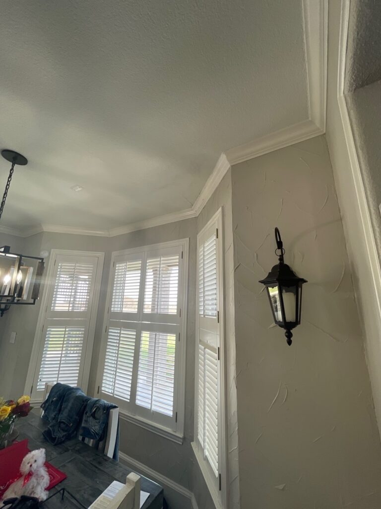 Tall interior wall and ceiling with windows during water mitigation in a McKinney, TX home