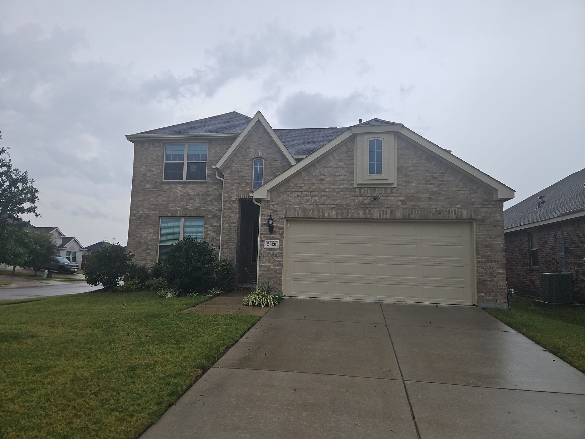 Front exterior of a Melissa, TX home with an asphalt shingle roof documented for roofing work