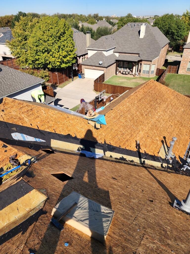 Residential roofing work in Allen, TX showing exposed roof decking during tear-off and replacement