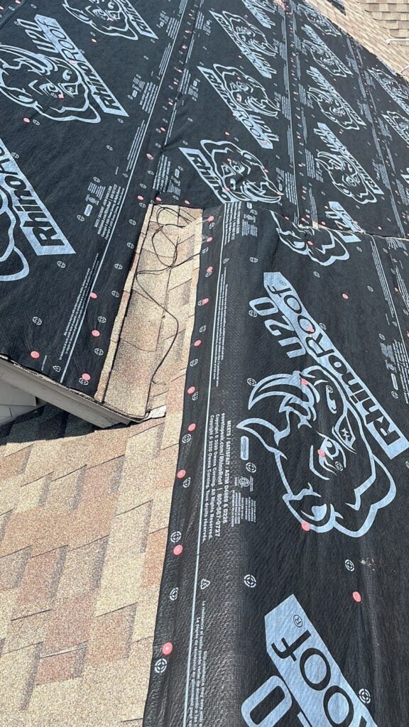 Synthetic roof underlayment installed on a residential roof during water intrusion repair in Van Alstyne, TX
