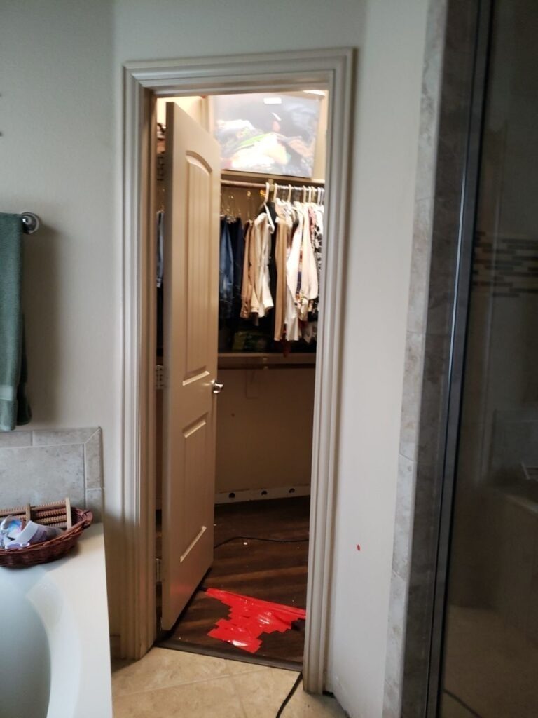 Bathroom doorway and adjacent closet area during water mitigation inspection in Denton, TX