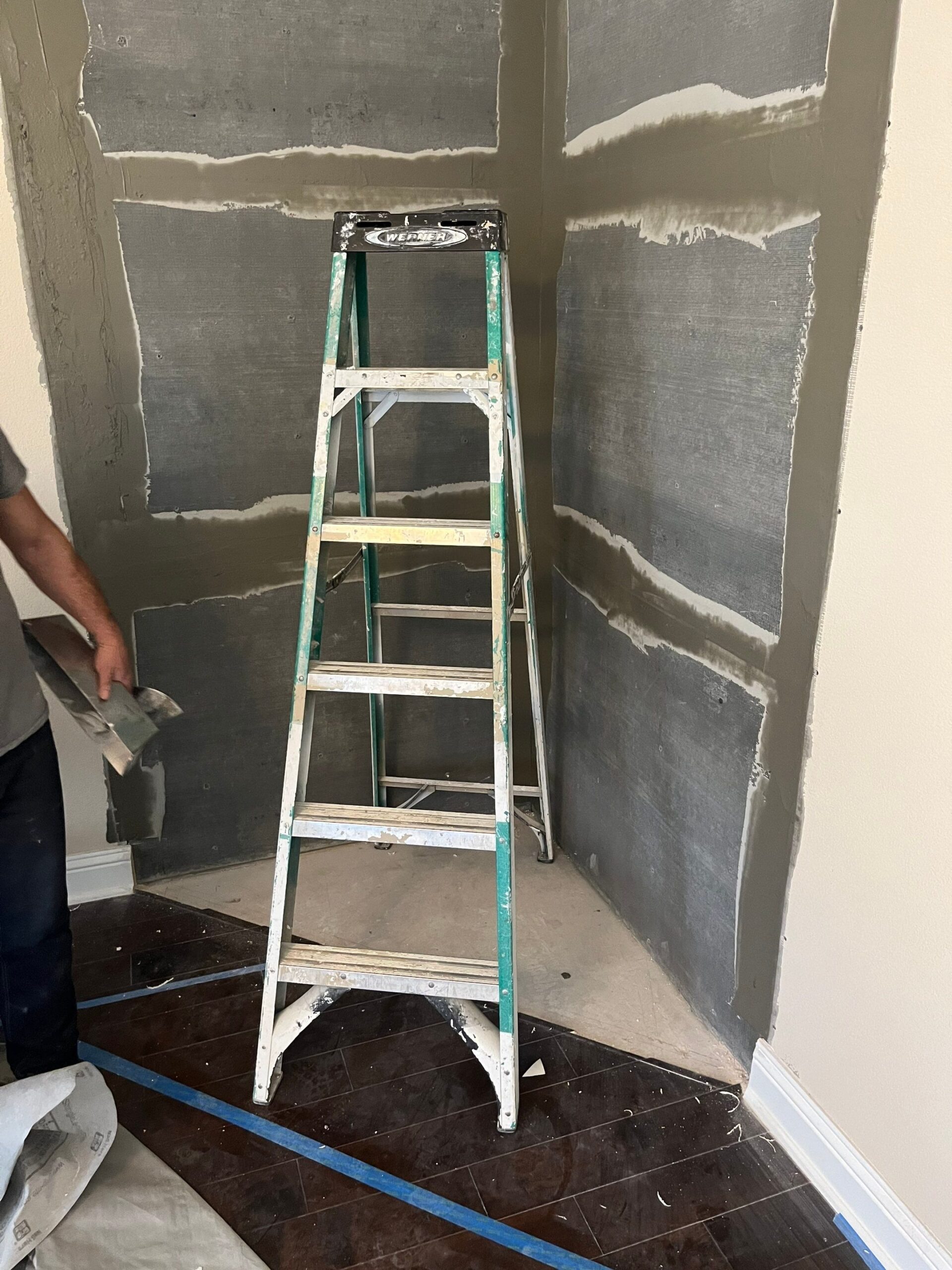 New wallboard going up around the fireplace opening in Melissa, TX