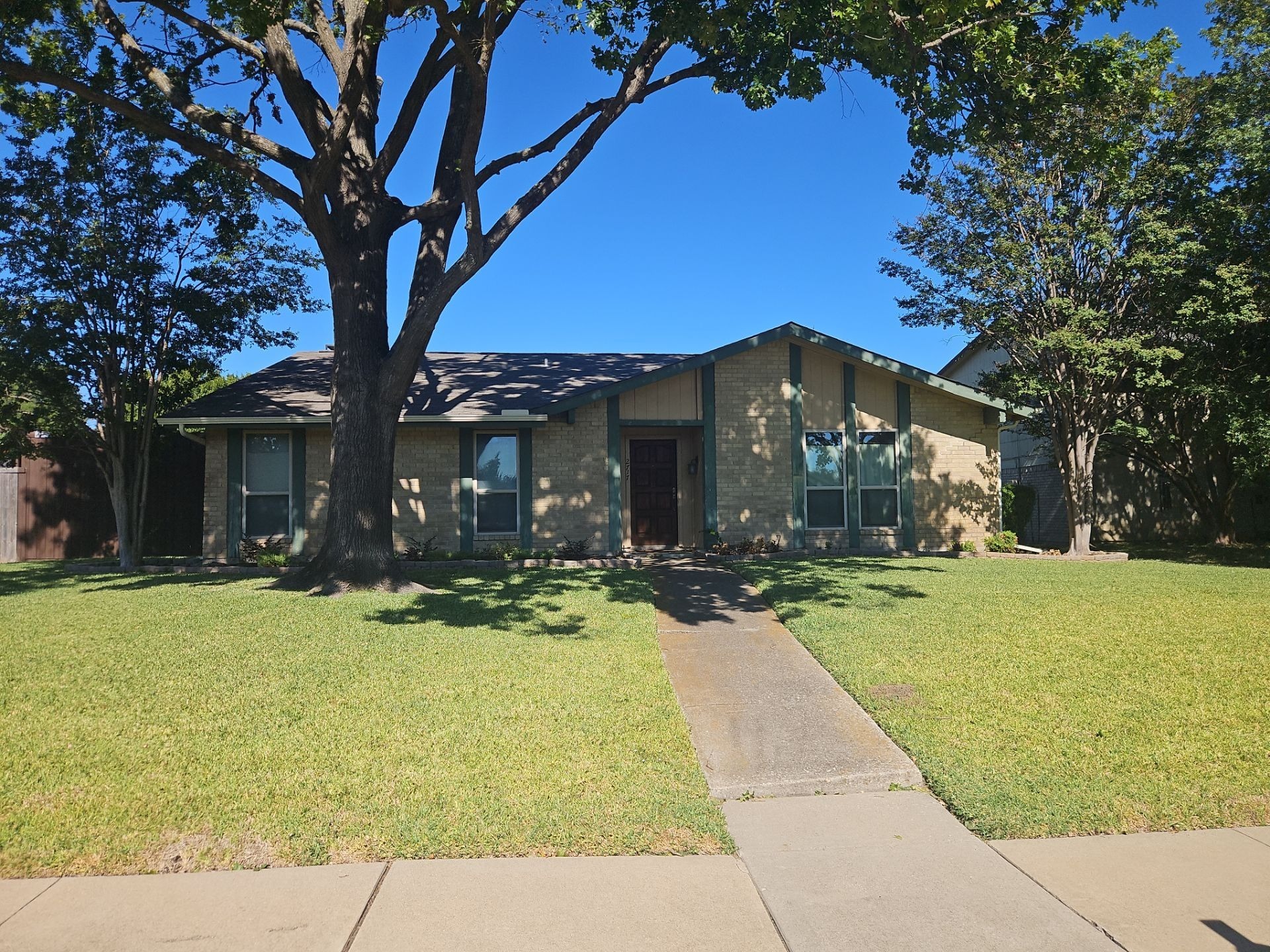 Before gutter cleaning in Plano, gutters sit packed with leaves and heavy debris