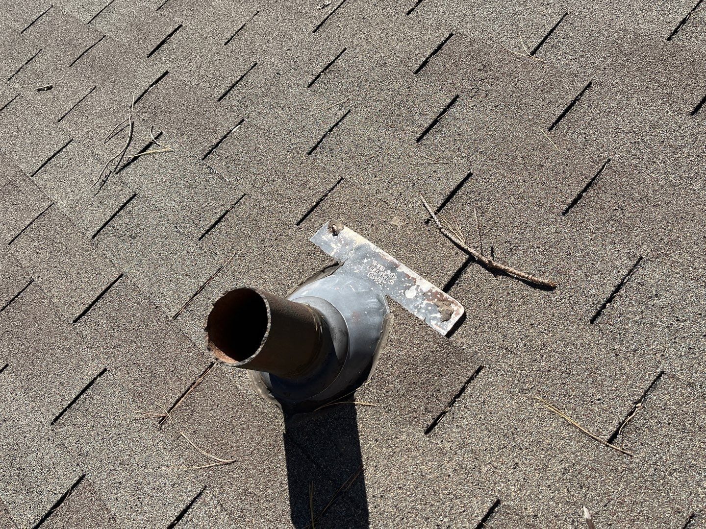 Cracked shingle tabs and granule loss documented before the roof replacement in Sherman, TX