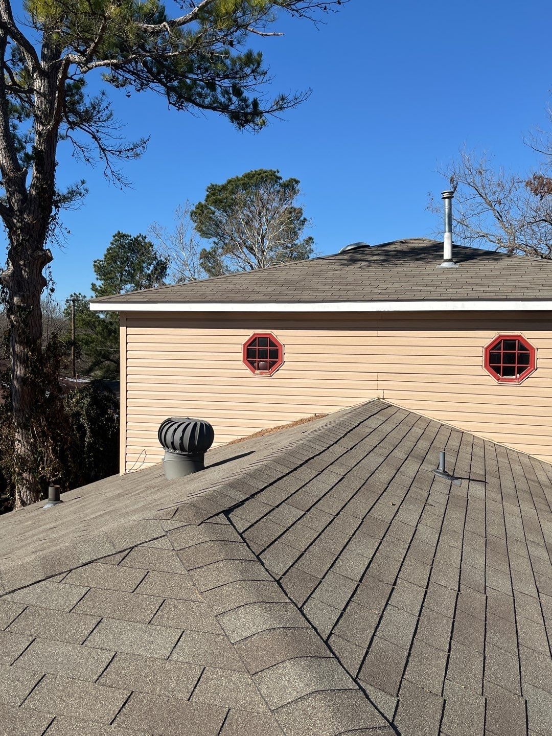 Overall view of storm-damaged roof before the roof replacement in Sherman, TX