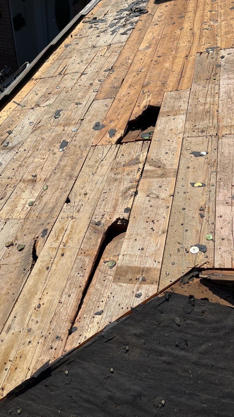 Exposed roof deck after old shingles are removed during the roof replacement in Sherman, TX