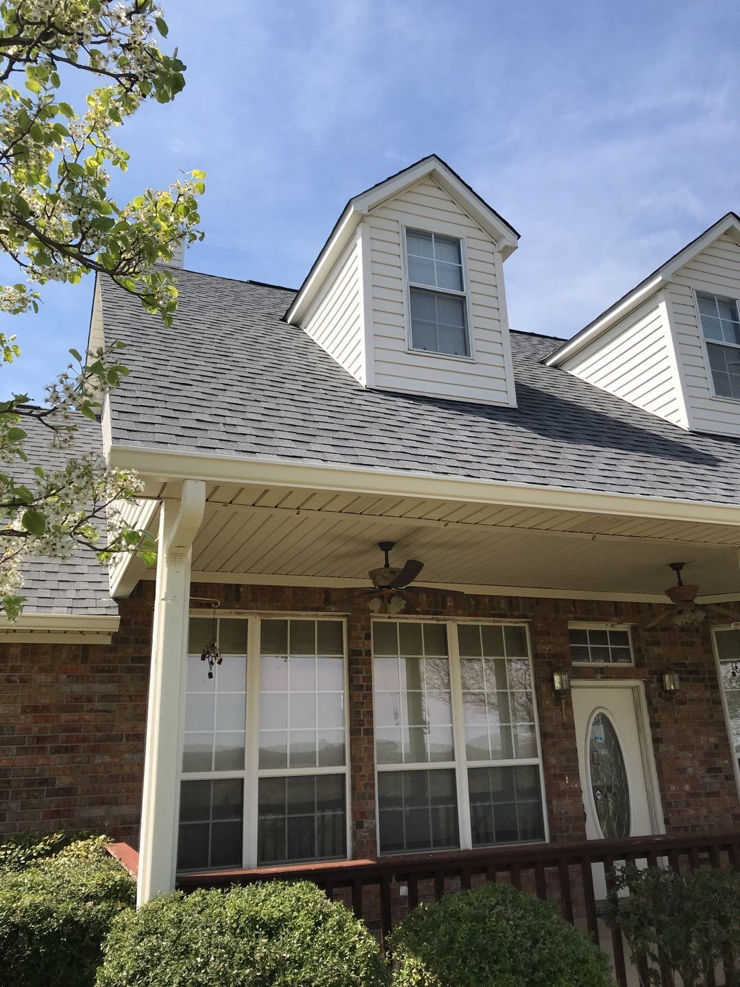 After roof replacement in Anna: finished farmhouse roof with new Atlas Pinnacle Pristine shingles