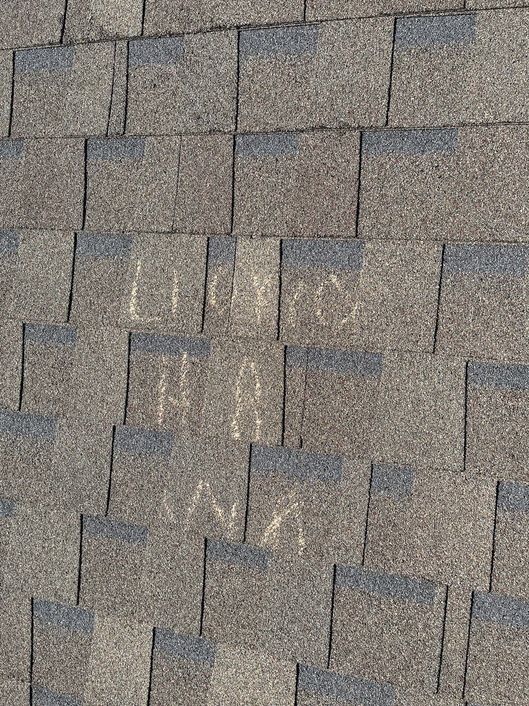 Wide view of hail damage across the roof before the roof replacement in Melissa, TX