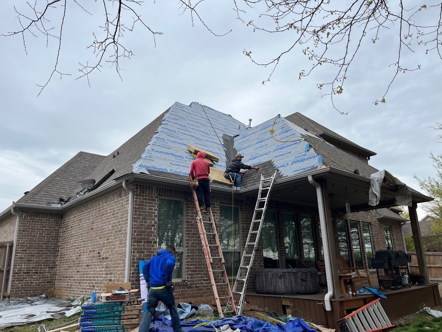 New flashing being fitted around a vent during the roof replacement in Sherman, TX