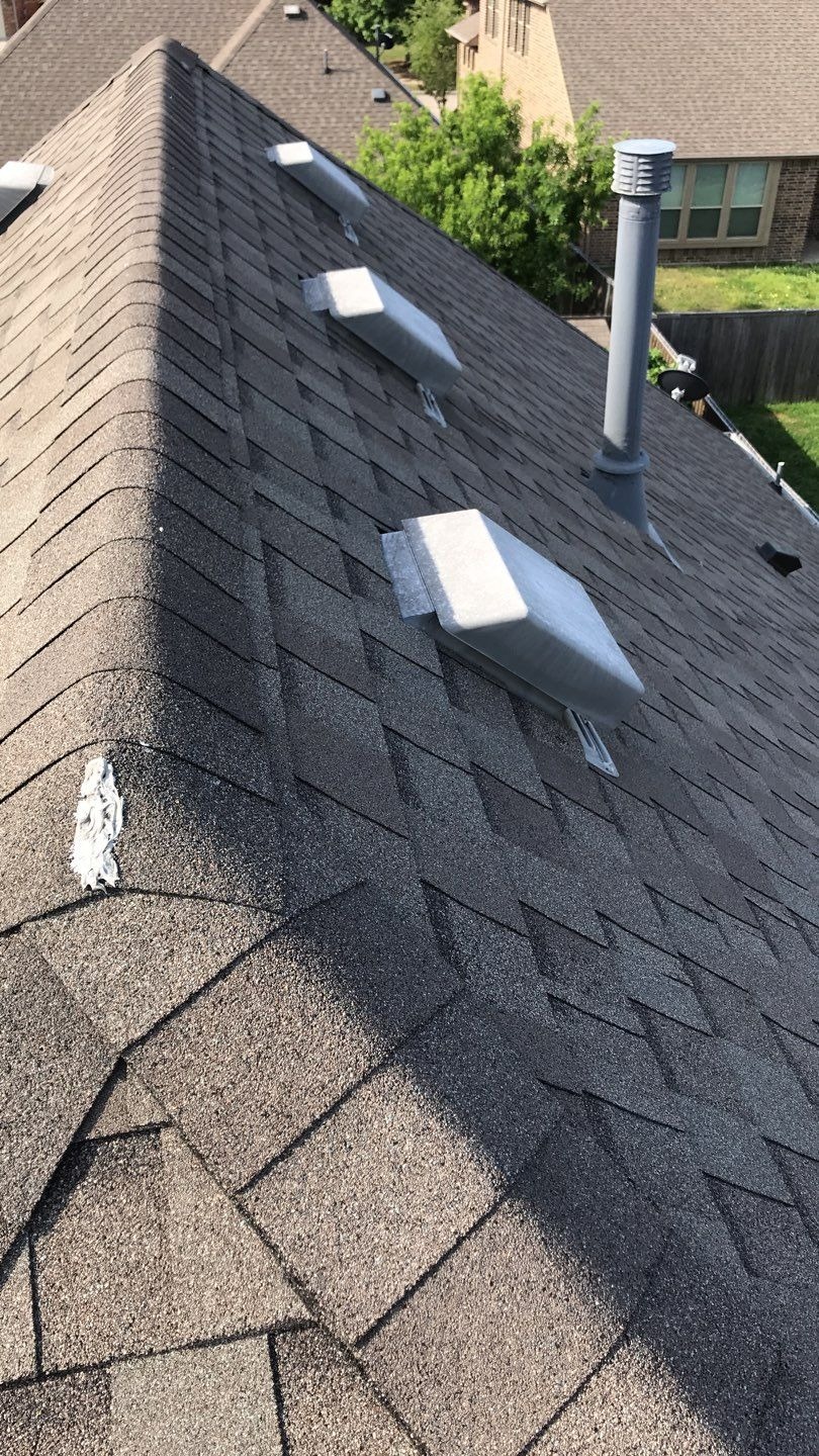 Bruised granule surface on aging shingles before the roof replacement in Melissa, TX