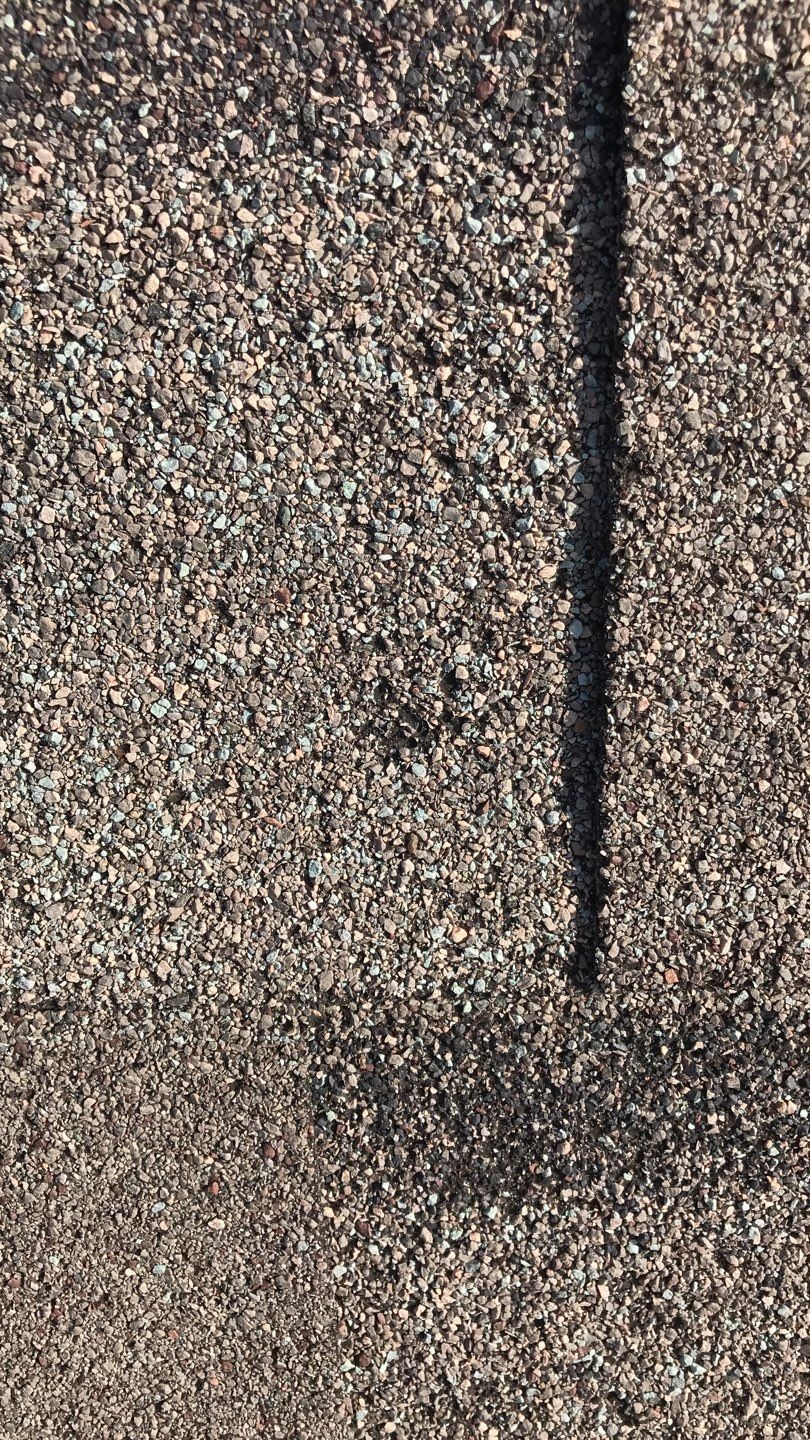 Missing granules exposing shingle mat before the roof replacement in Melissa, TX