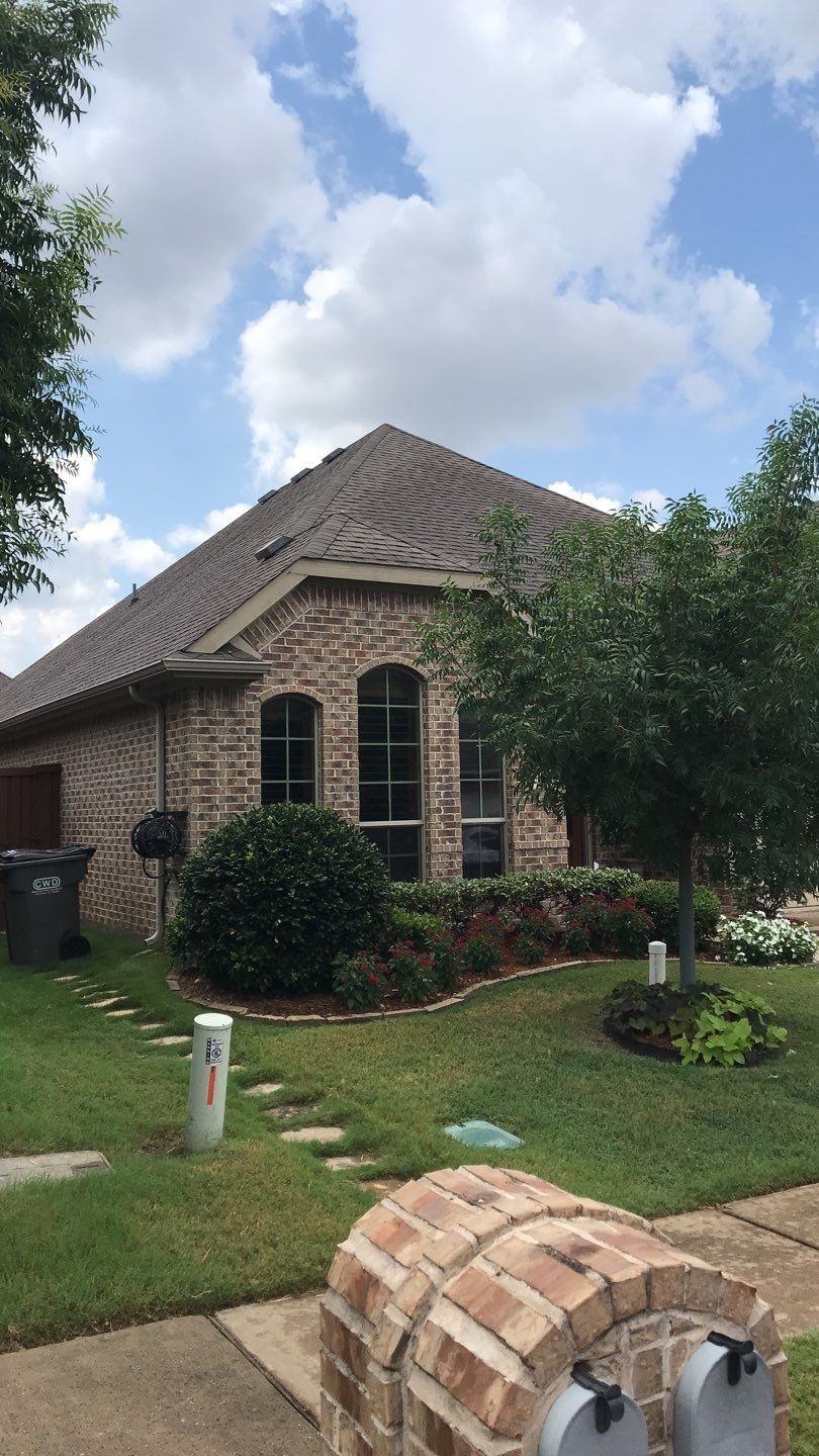 Cracked shingle mat showing hail impact before the roof replacement in Melissa, TX