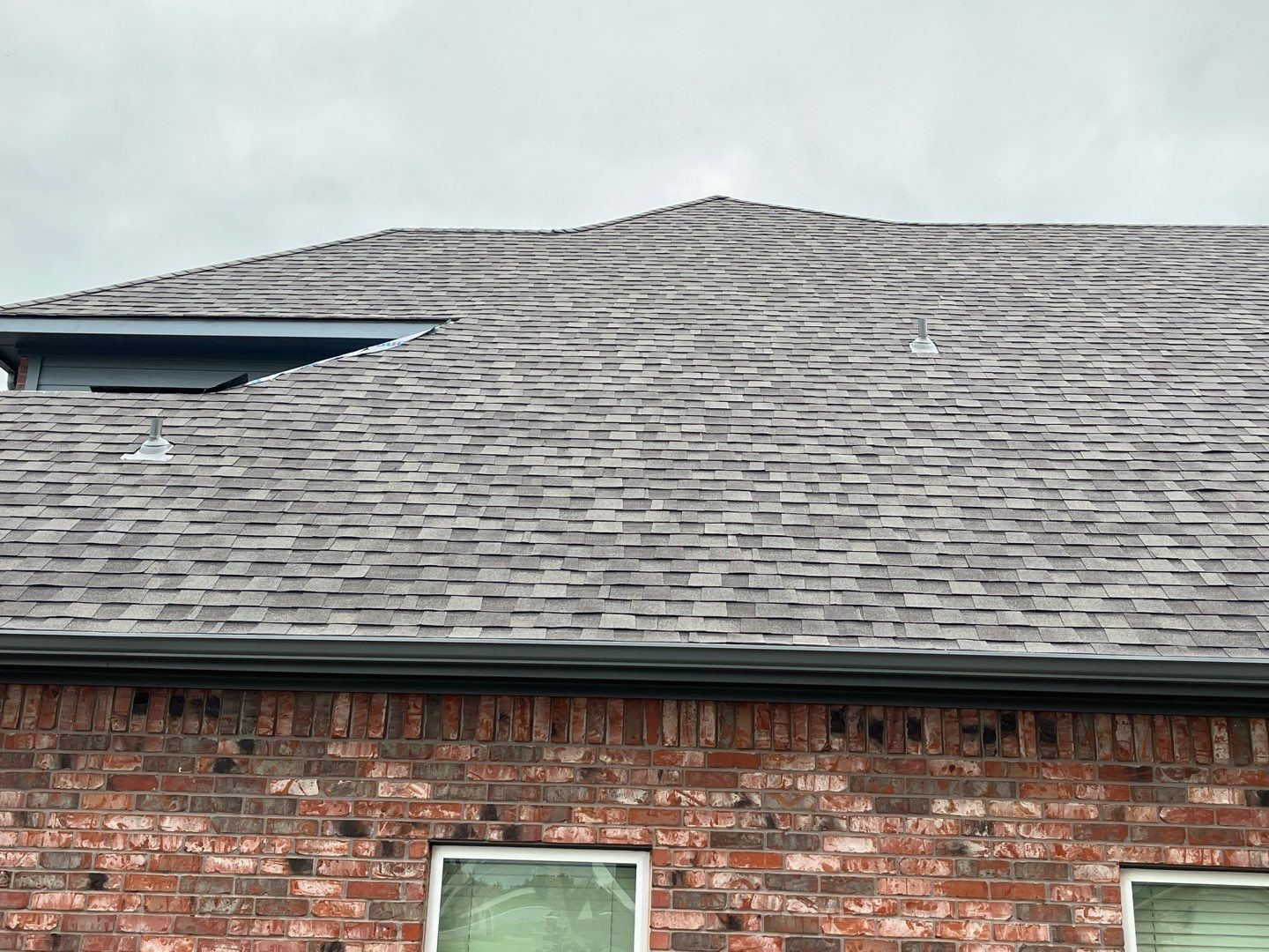 Completed shingle field after the roof replacement in Sherman, TX