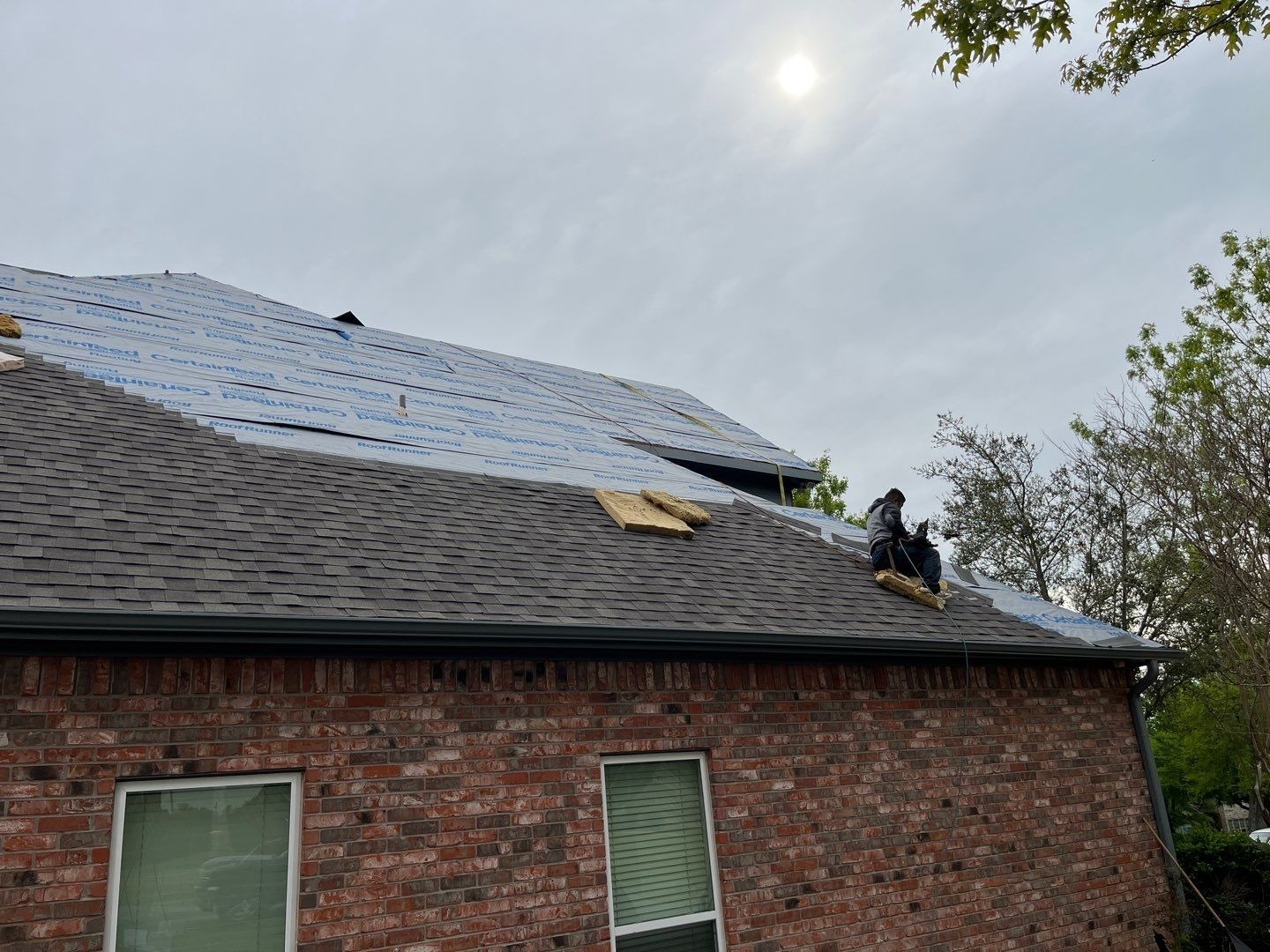 New flashing being fitted during the roof replacement process in Sherman