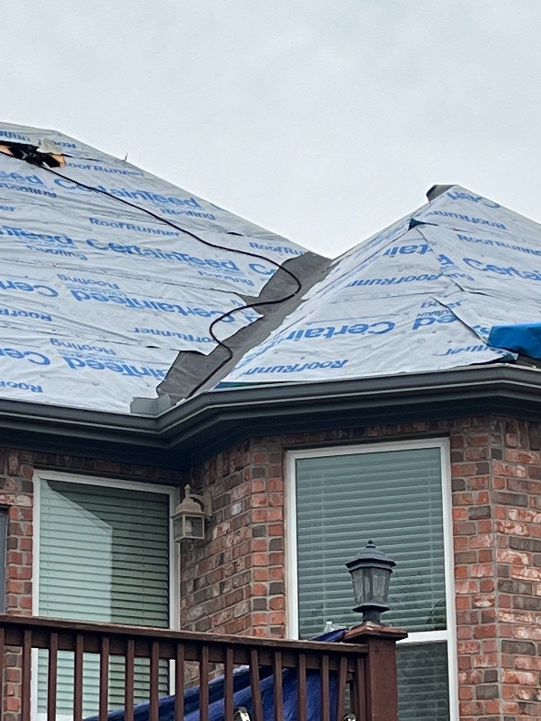 Pool covered for protection during the roof replacement in Sherman, TX