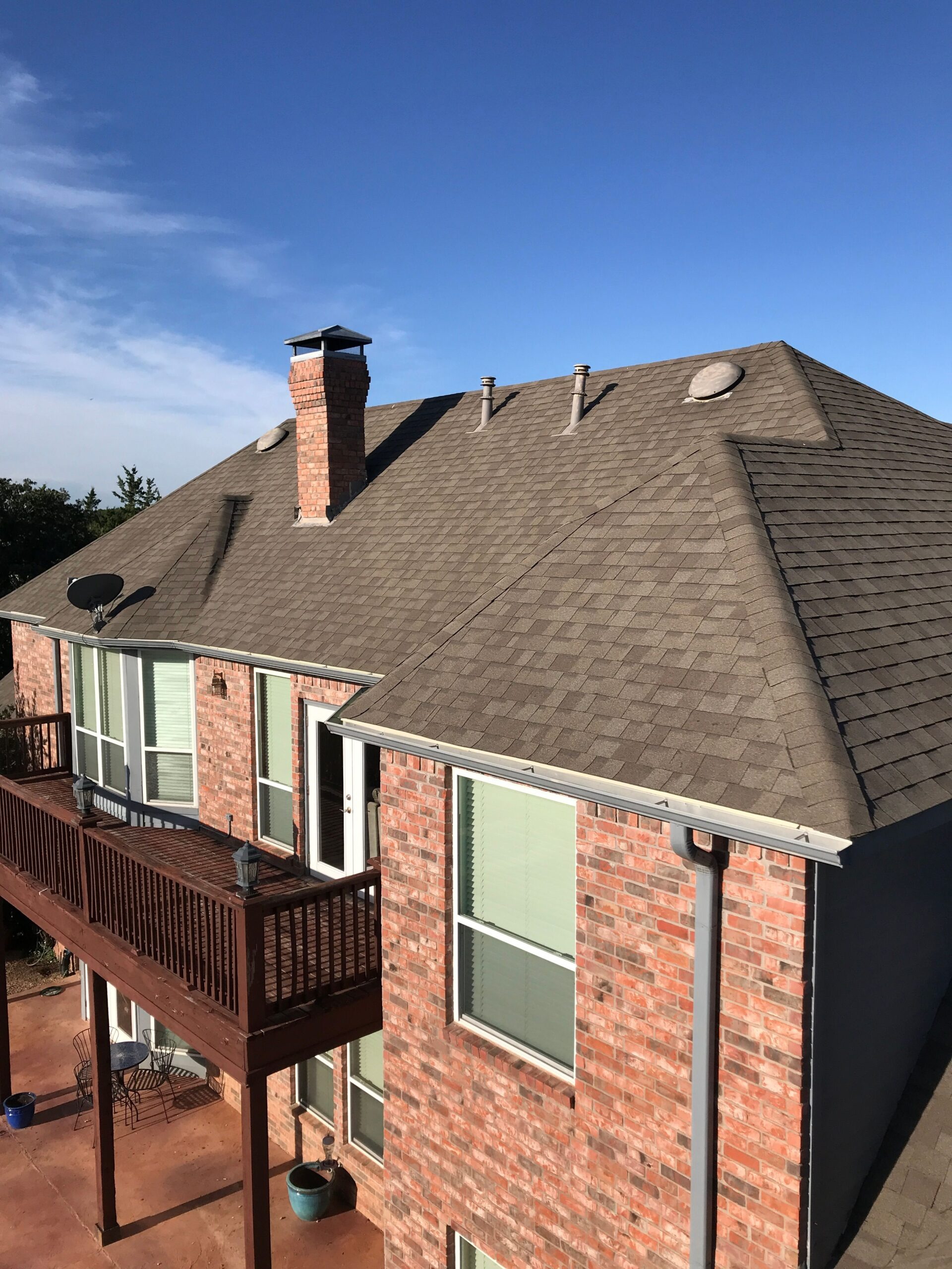 Hail-damaged shingles found before the roof replacement in Sherman, TX