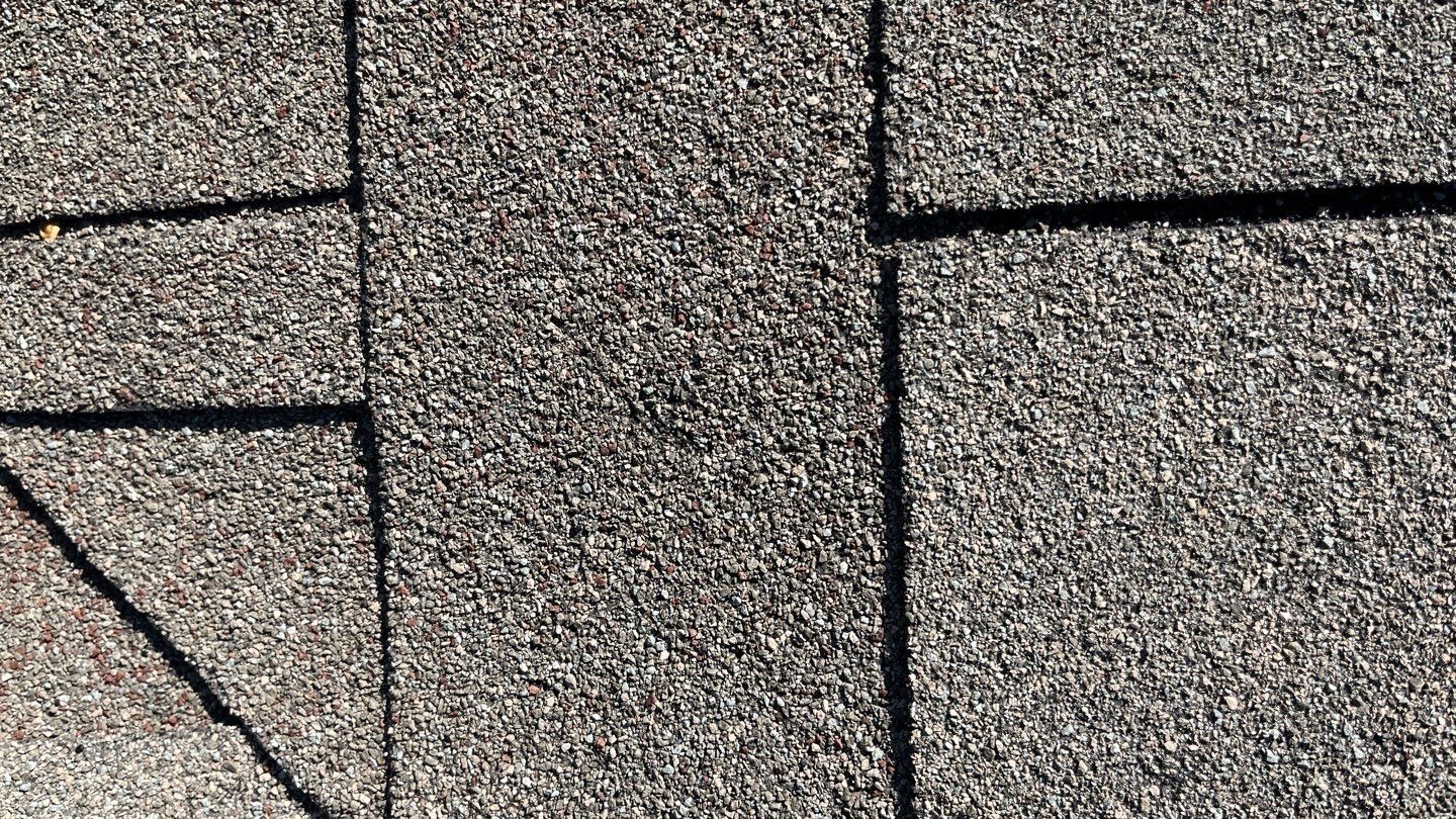 Before: additional angle of hail-damaged roof slope prior to tear-off in Anna, TX