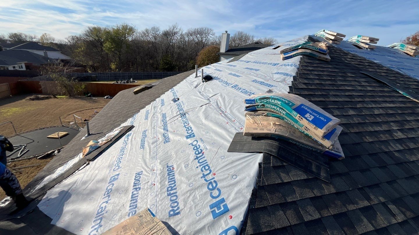 During: synthetic underlayment installation across decking in Anna, TX roof replacement