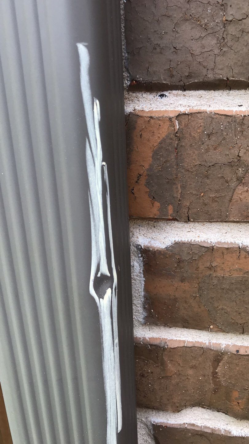 Impact spots across shingle field before the roof replacement in Melissa, TX