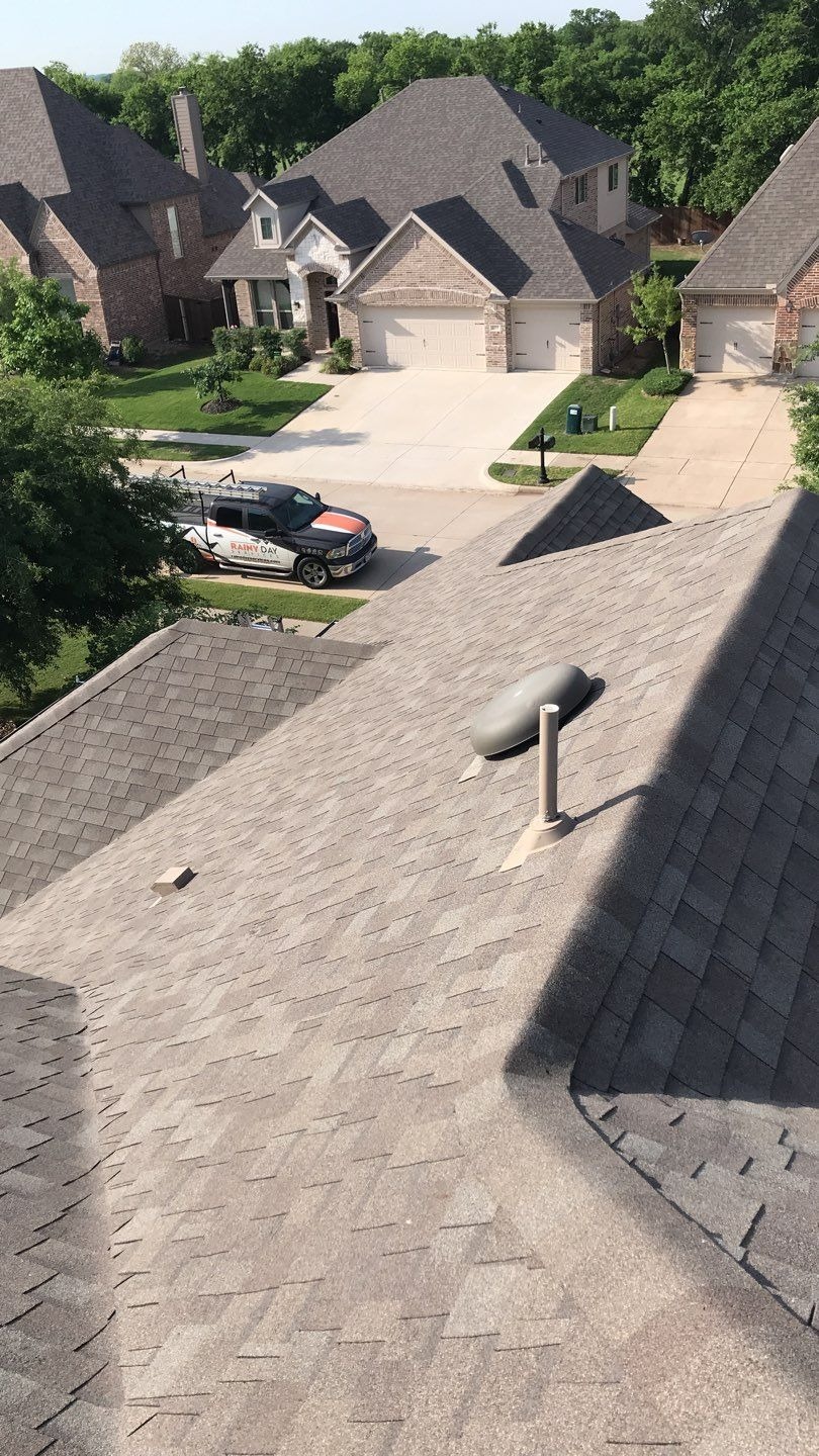 Cracked shingle surface documented before the roof replacement in Melissa, TX