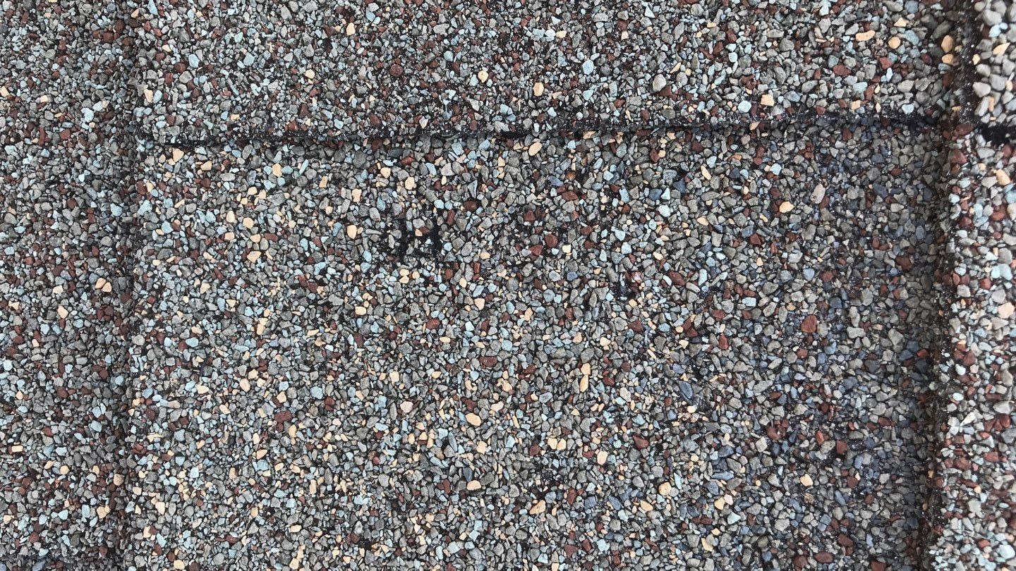 Hail impact marks on flashing before the roof replacement in Melissa, TX