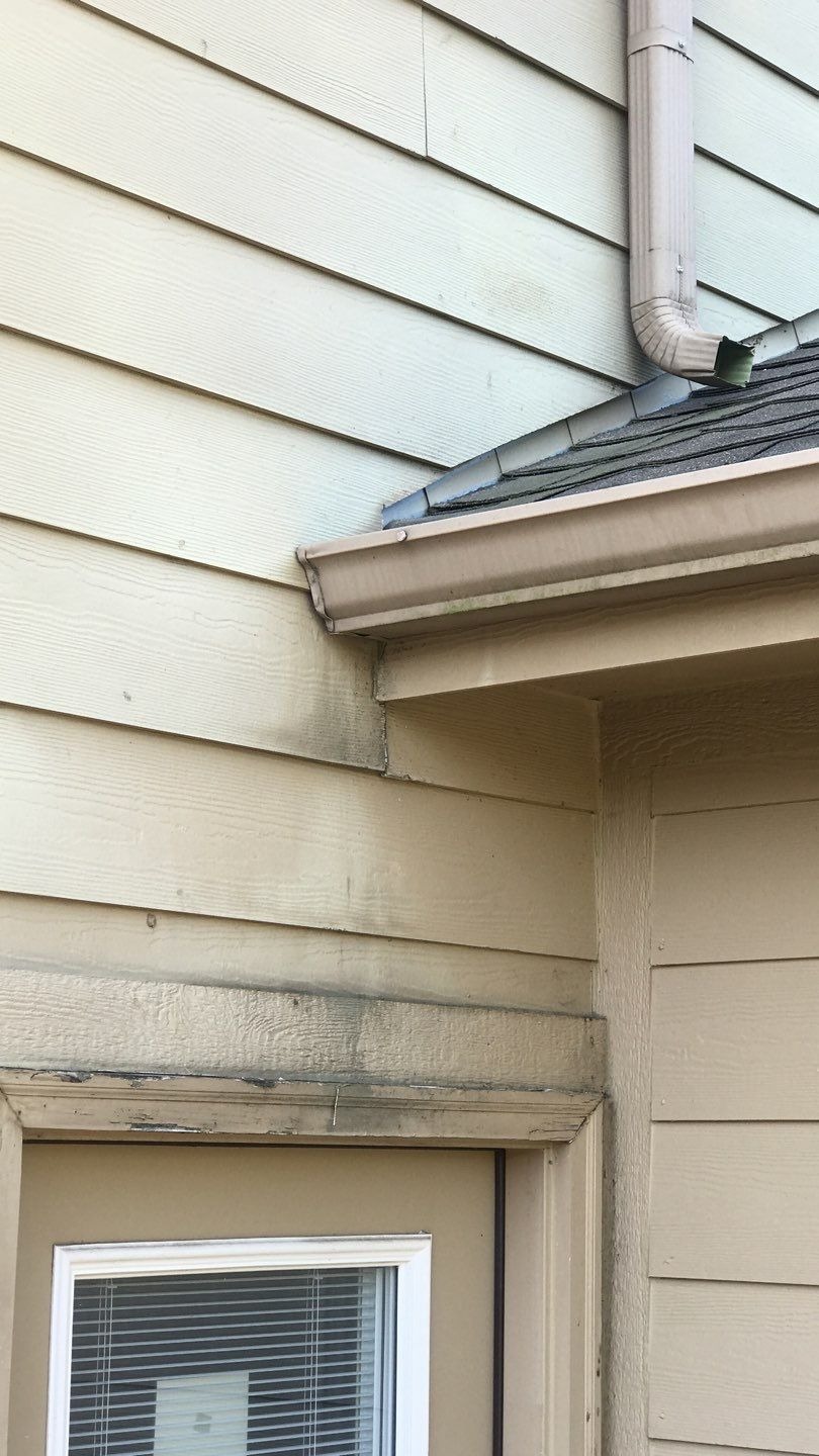 Before roof replacement in Anna: close-up of hail bruising on shingle surface before tear-off