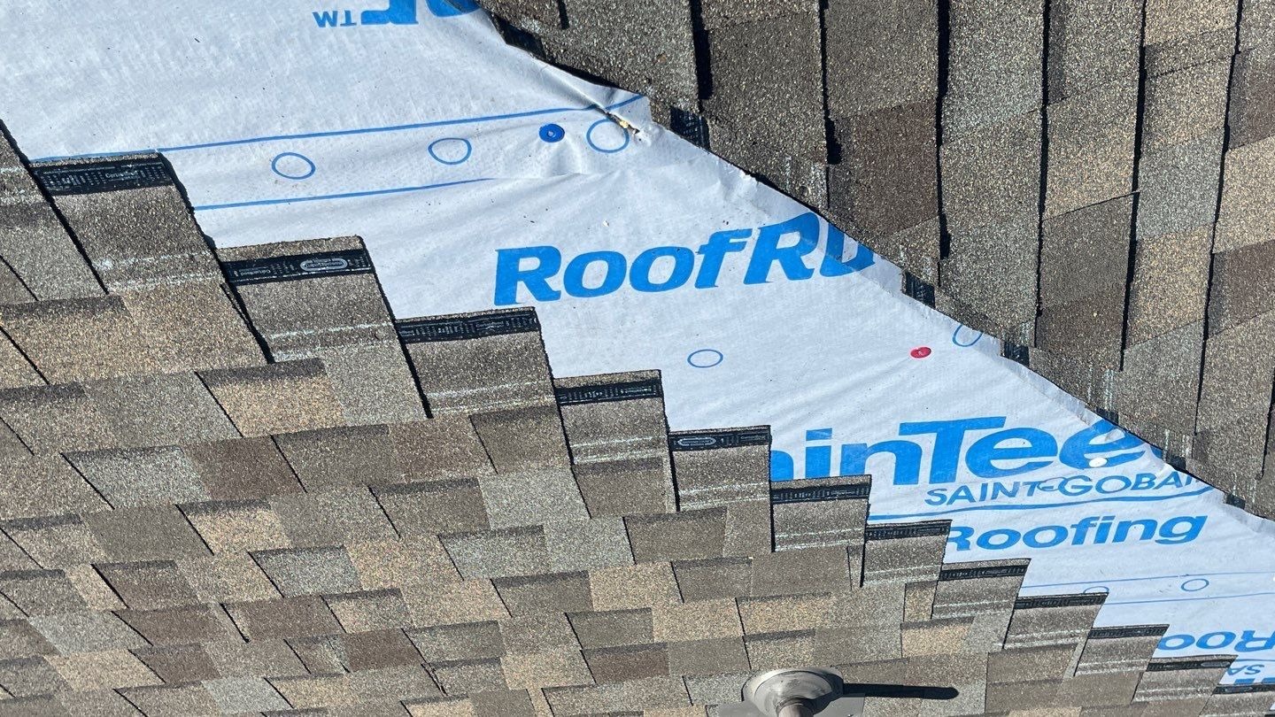 New underlayment being installed during the roof replacement in Sherman, TX
