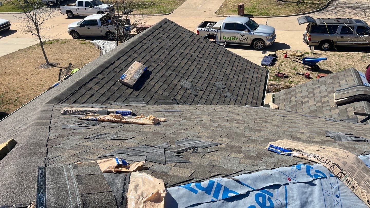 New shingles being installed during the roof replacement in Sherman, TX