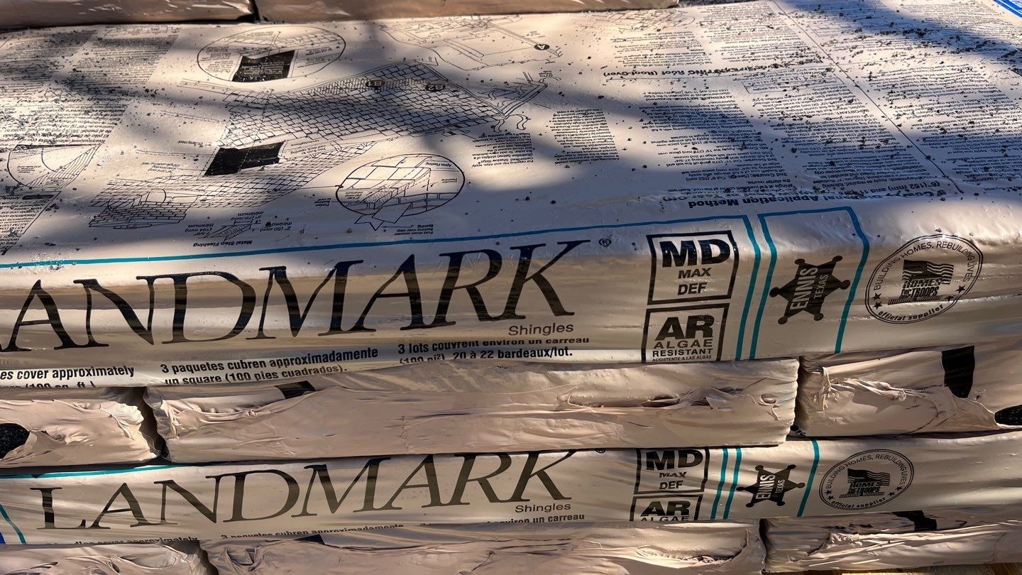 Crew performing full tear-off during the roof replacement in Sherman, TX
