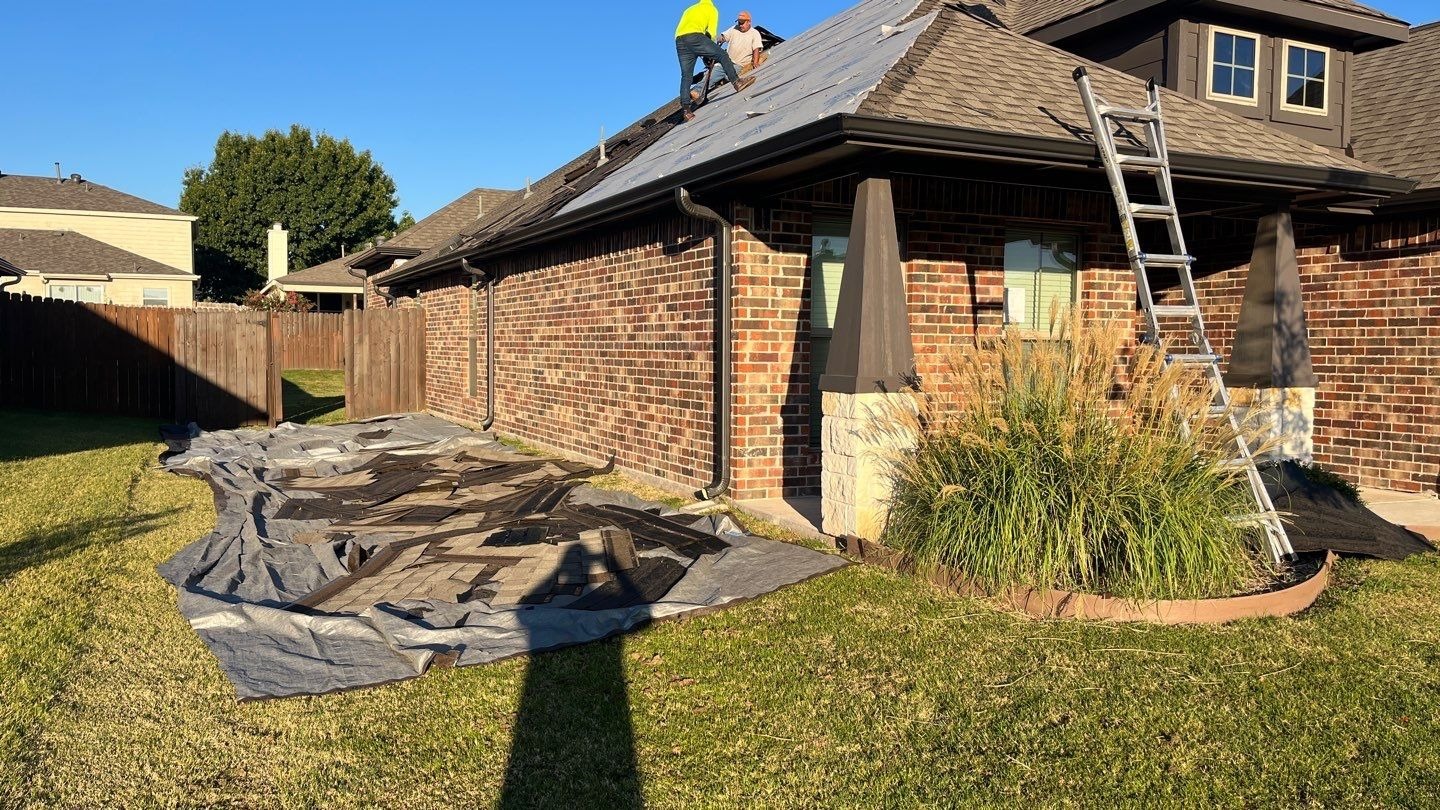 Crew beginning full tear-off during the roof replacement in Sherman, TX