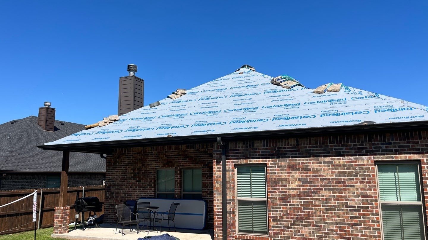 New shingles going down mid-installation during the roof replacement in Sherman, TX