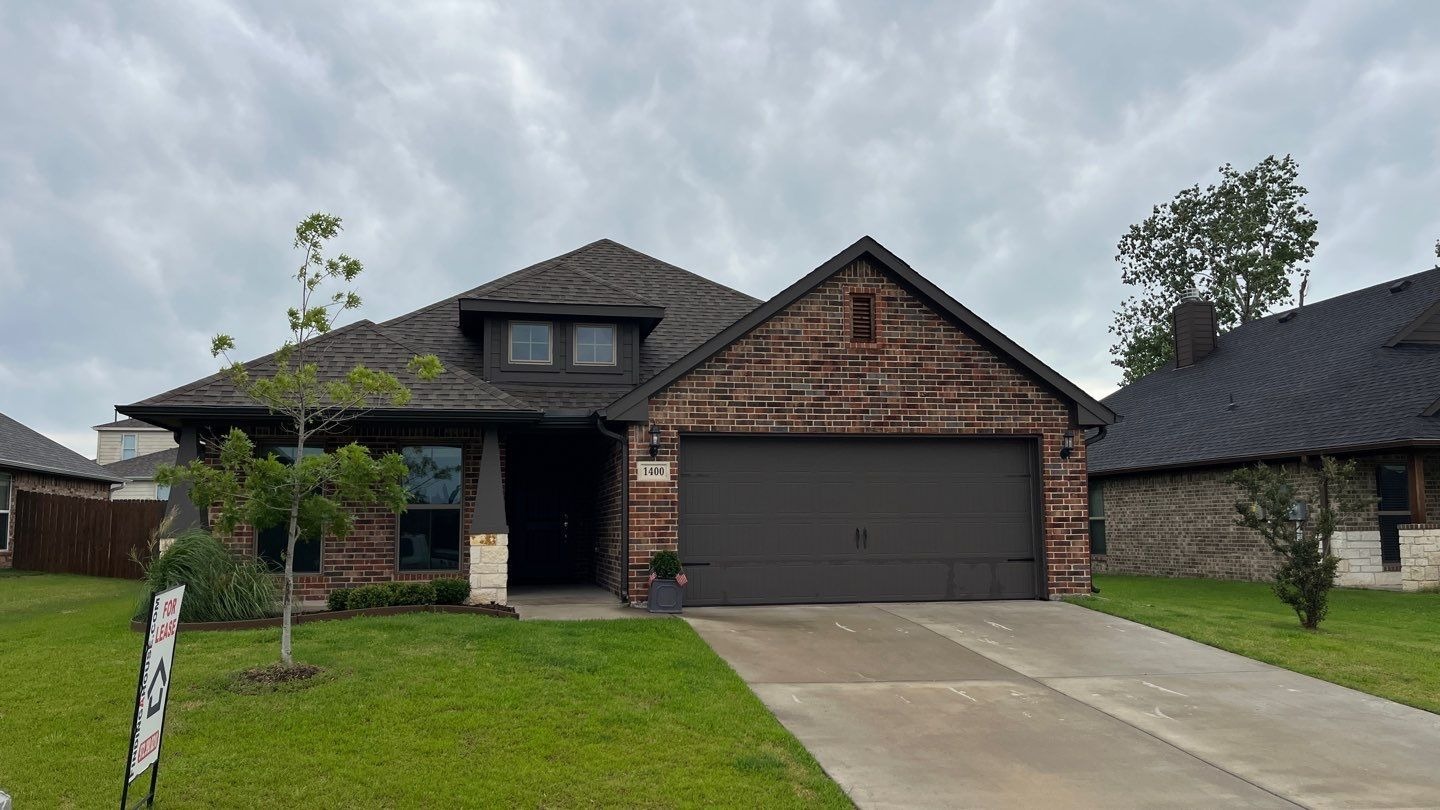 Hail-damaged shingles found before the roof replacement in Sherman, TX