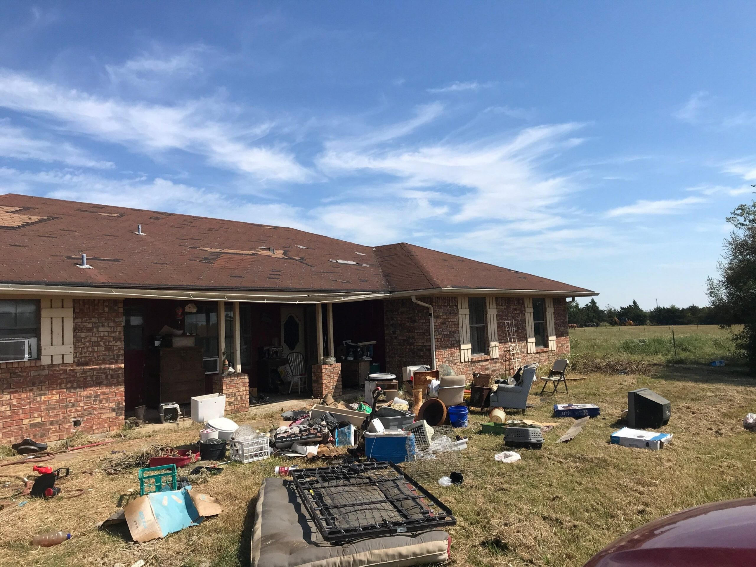 Gutter pulling away from damaged fascia before the roof replacement in Sherman, TX