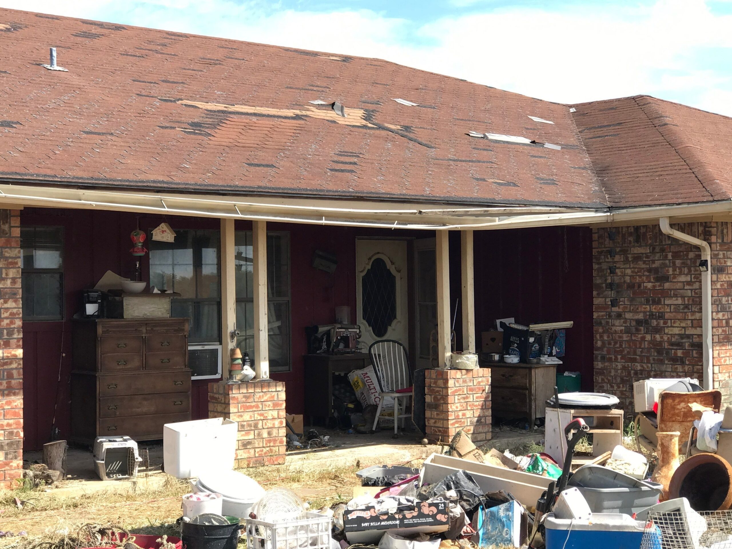Worn roof deck area showing end-of-life shingle wear before the roof replacement in Sherman, TX