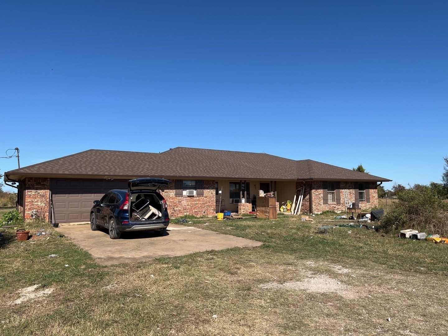 Finished architectural shingle roof after the roof replacement in Sherman, TX