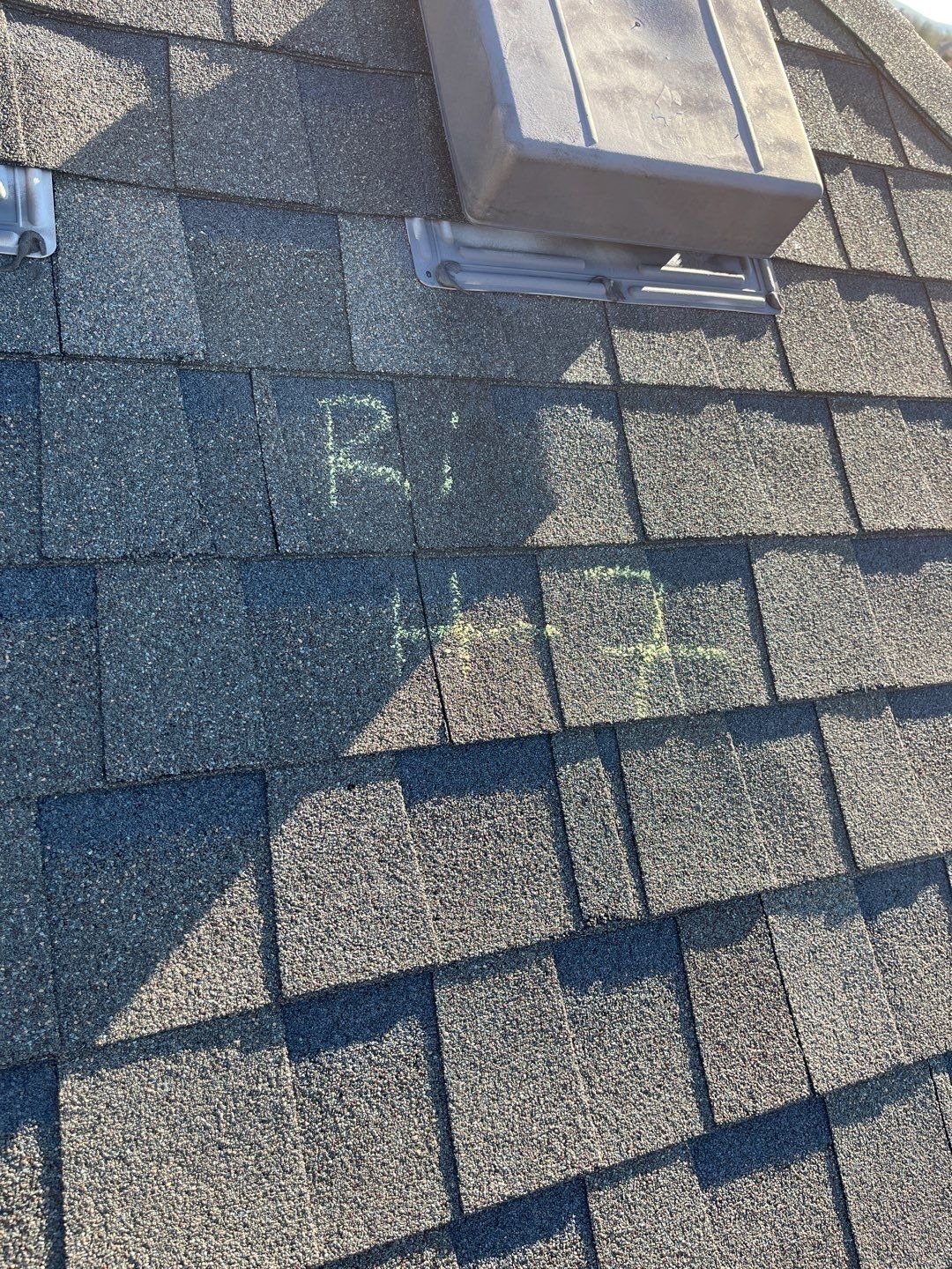 Displaced shingles along the roof edge before tear-off in Melissa, TX