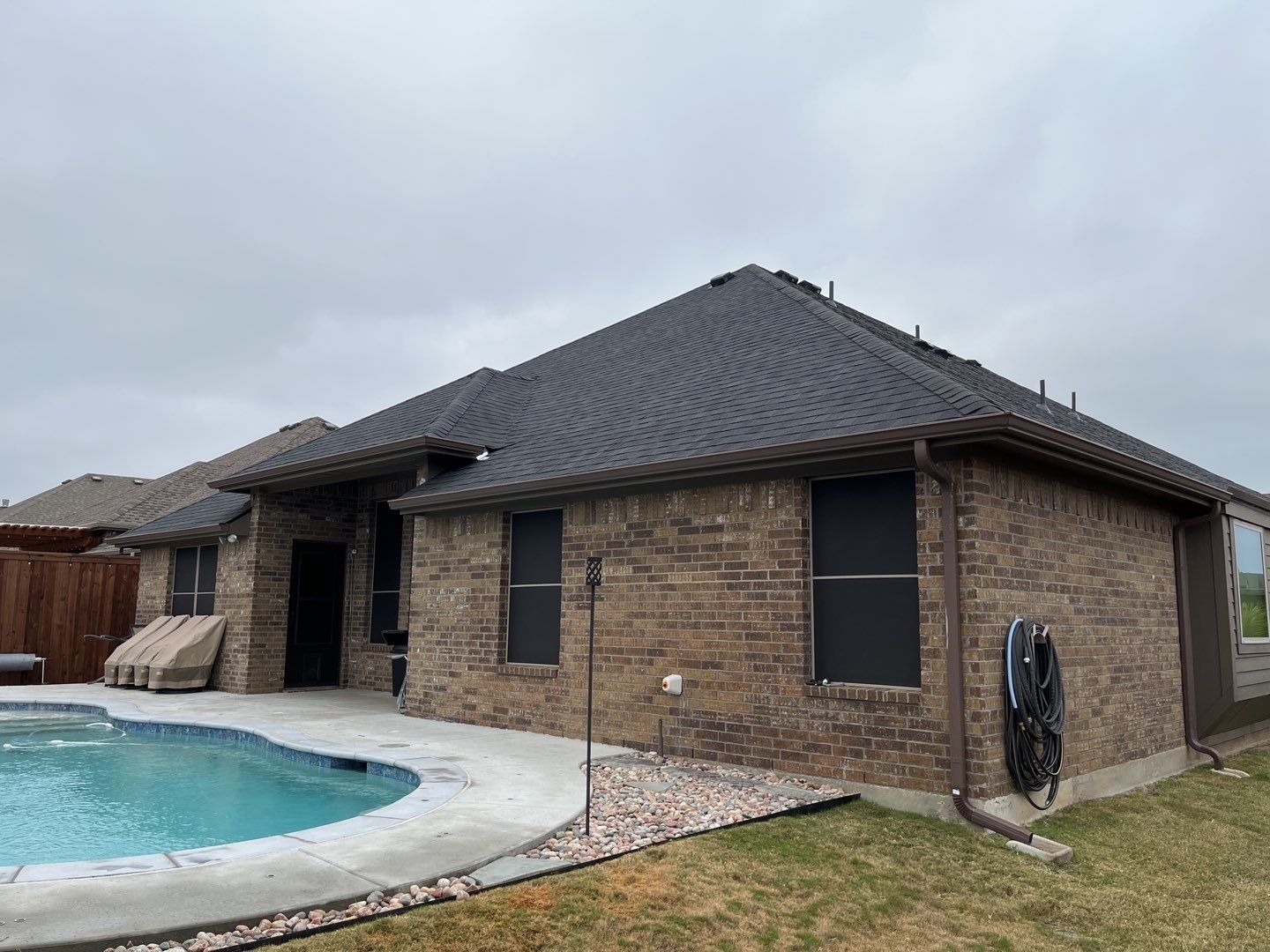 Completed roof replacement showing new shingles and flashing in Melissa, TX