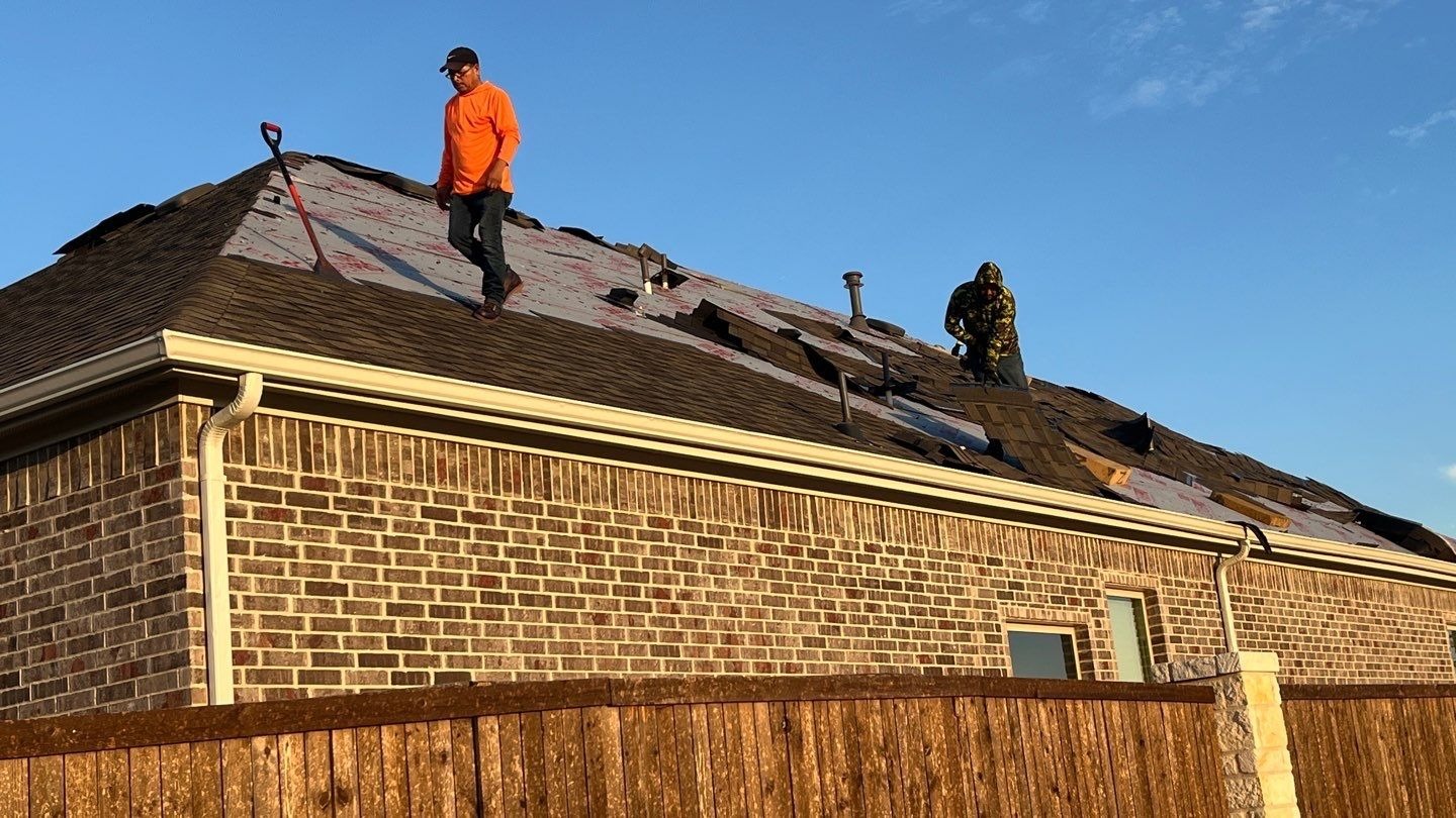 During roof replacement in Anna: new shingle courses going down along the roofline