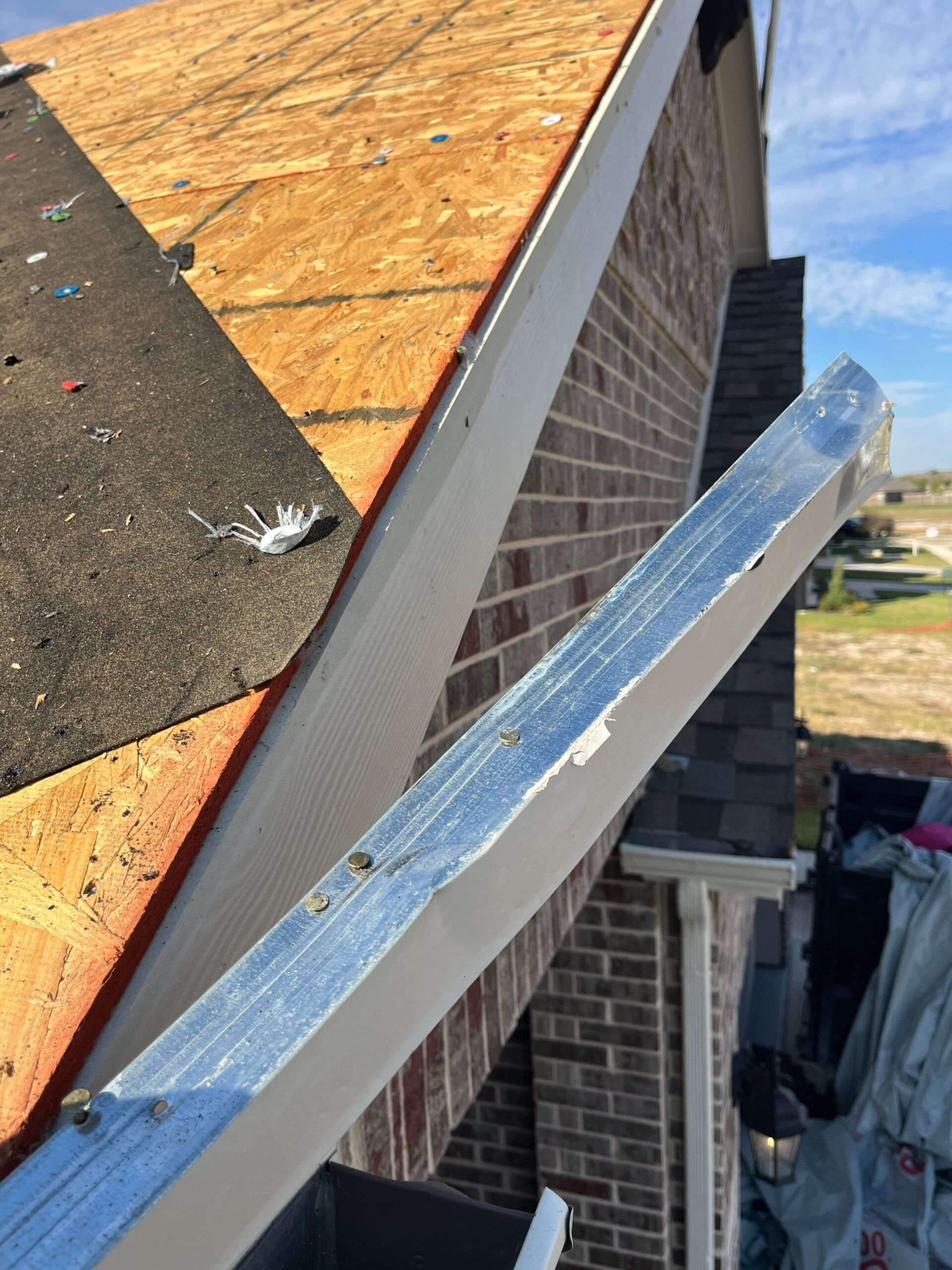 During roof replacement in Anna: flashing installation around a roof penetration during the rebuild