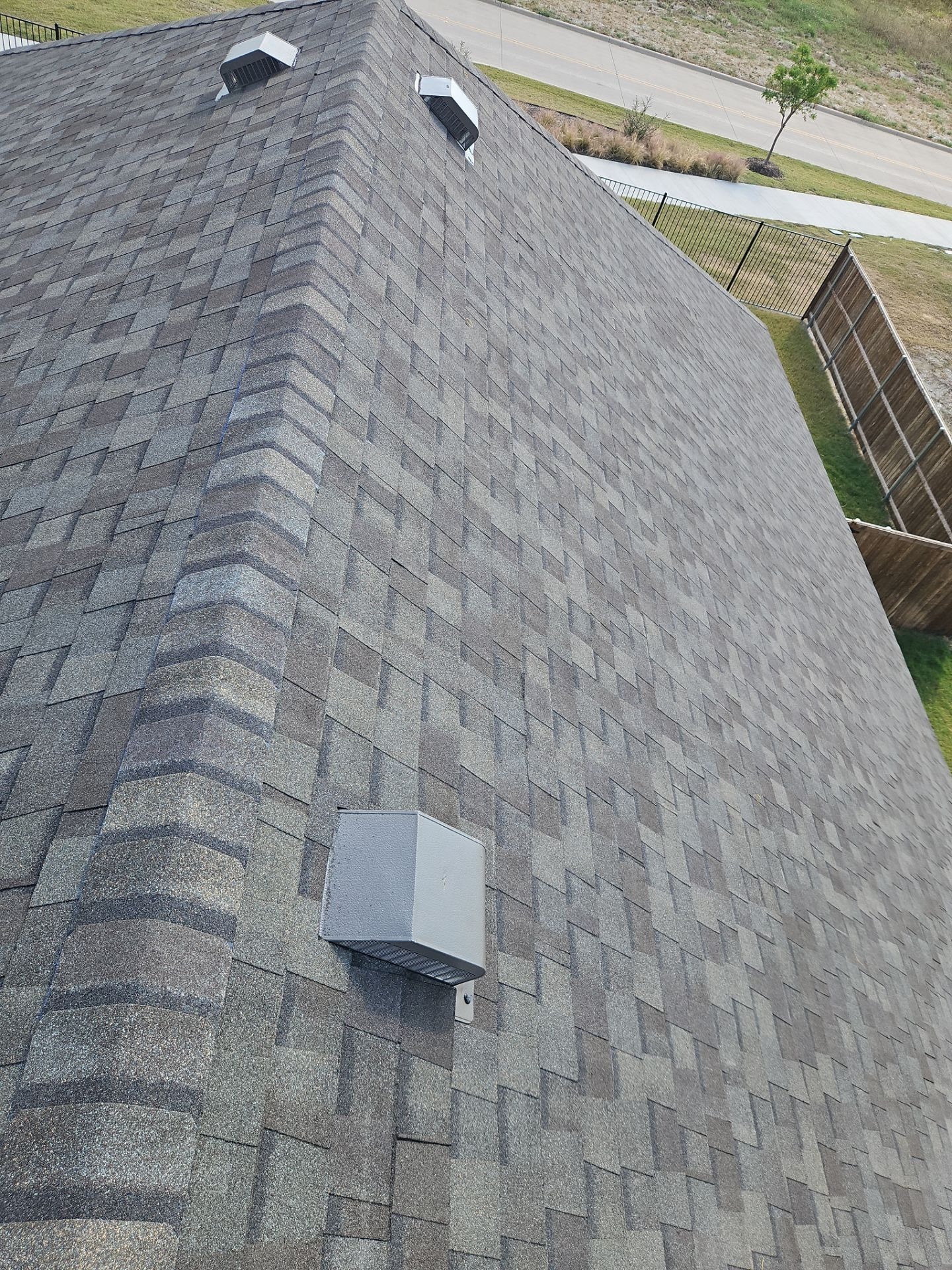 After roof replacement in Anna: finished roof slope showing the new Weather Wood shingle color