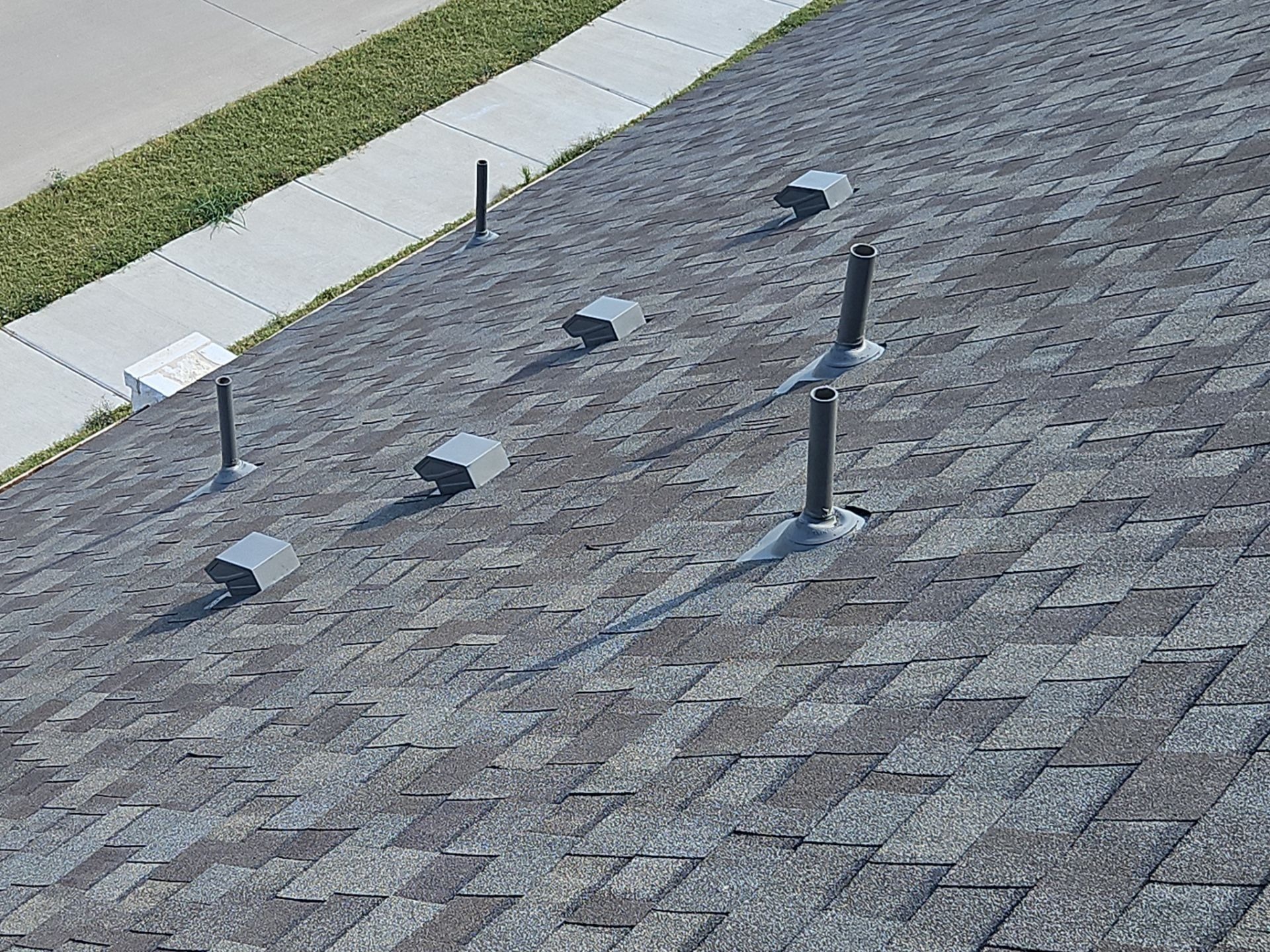 After roof replacement in Anna: newly installed gutter replacing the storm-damaged section