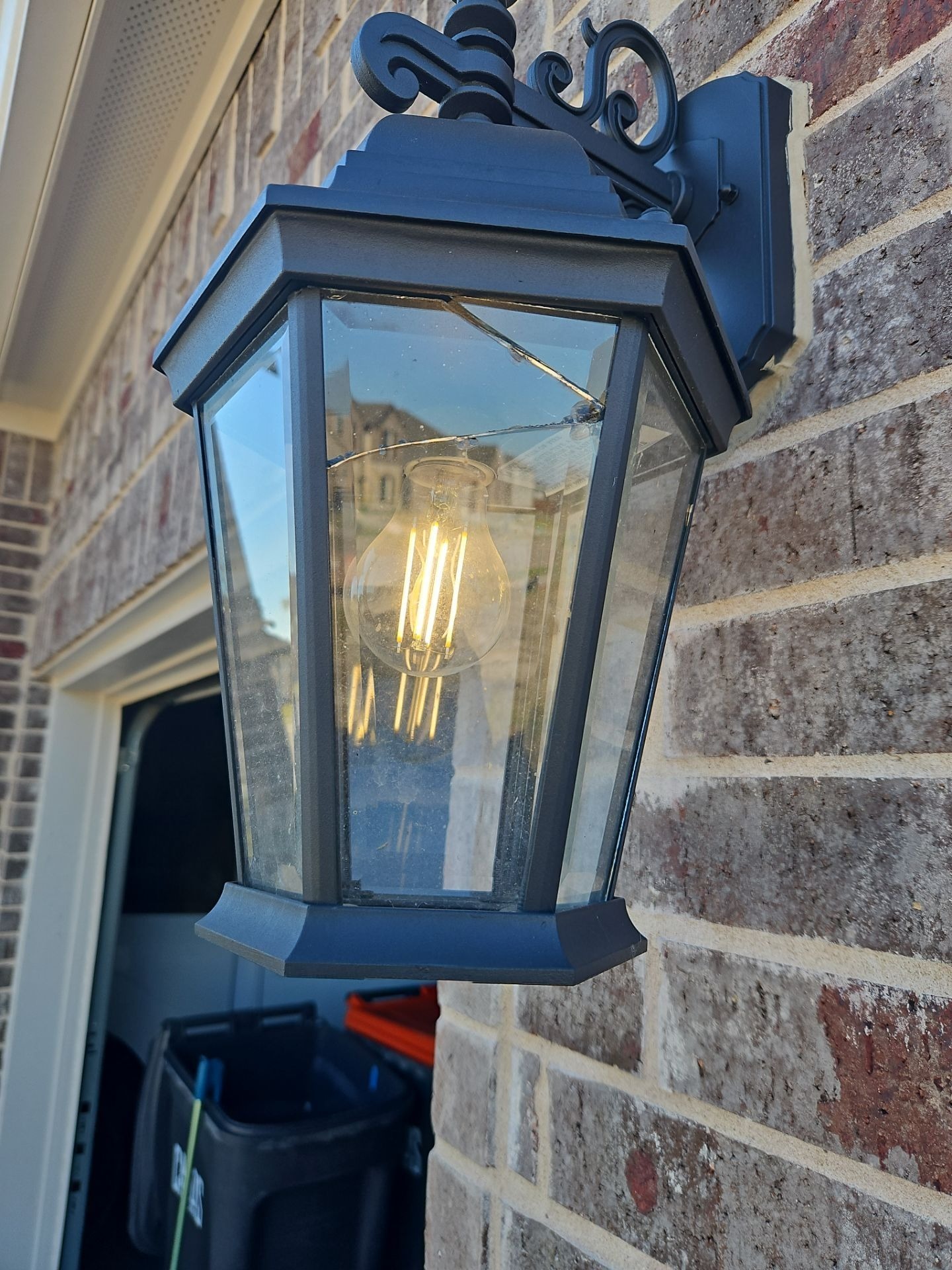 Before roof replacement in Anna: damaged window identified during the initial hail damage inspection