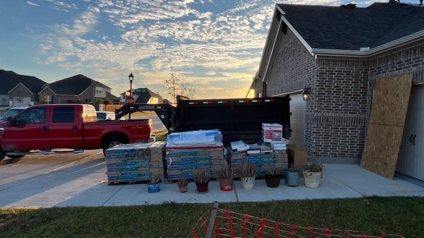 During roof replacement in Anna: exposed roof deck after full tear-off of damaged shingles
