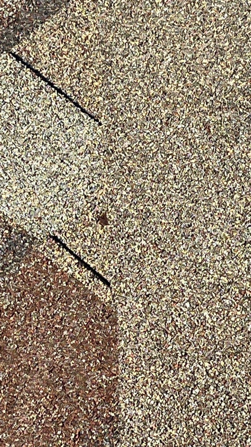 Wide view of affected roof section before roof repair in Melissa, TX