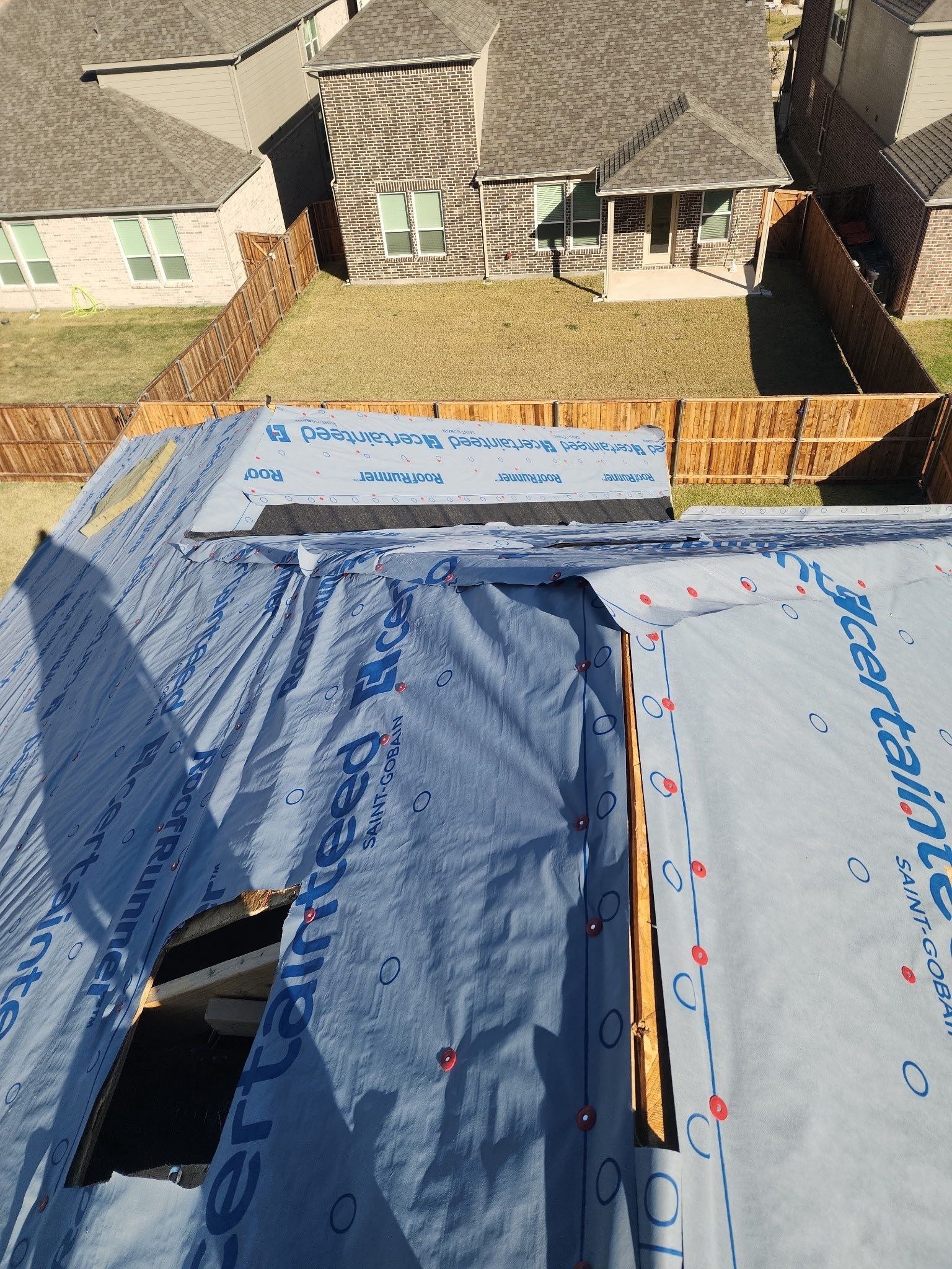 Finished shingle field after completed roof replacement in Anna home